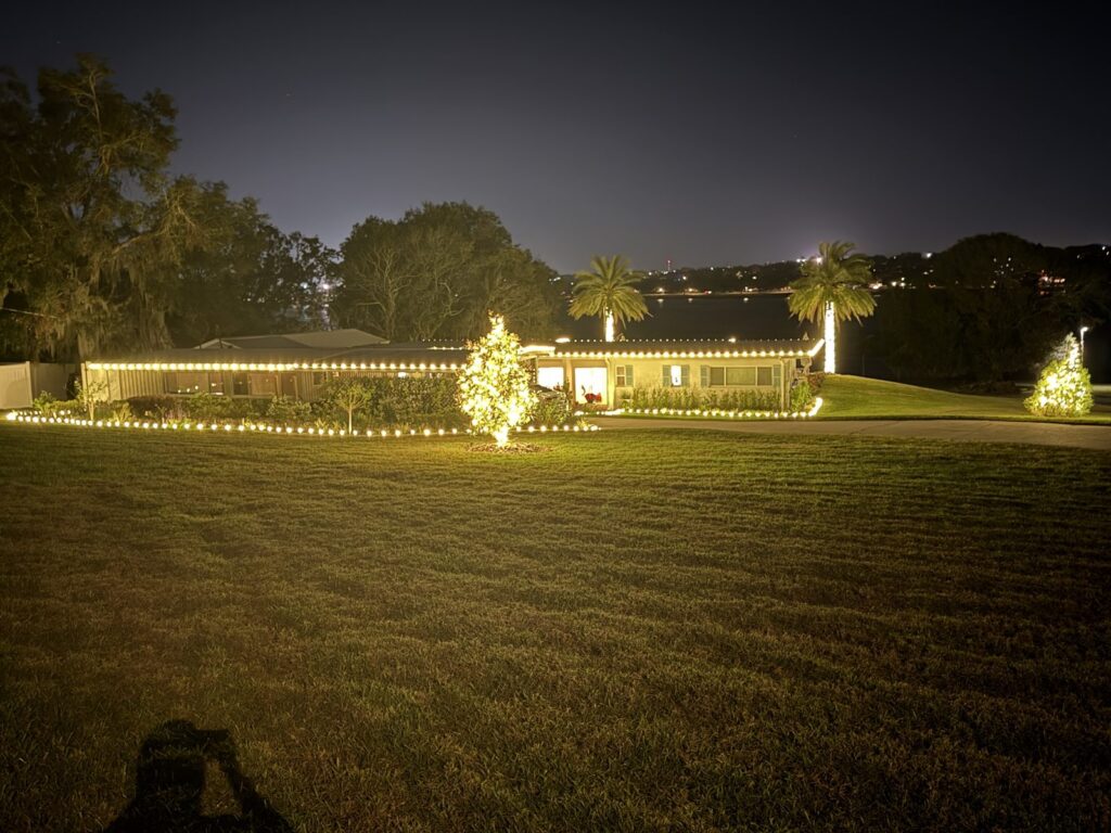 How to choose a Christmas light installer: a lakeside ranch home lit by a professional crew