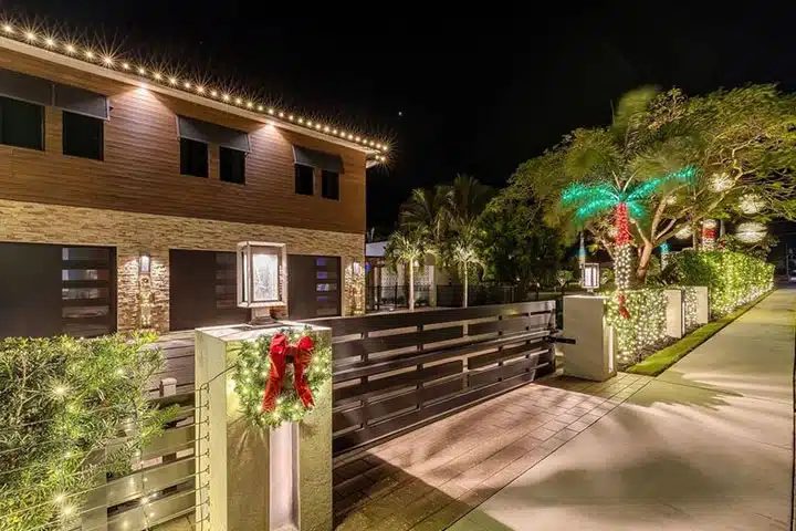Christmas light installation on a modern two-story home, the same work we do in Dr. Phillips